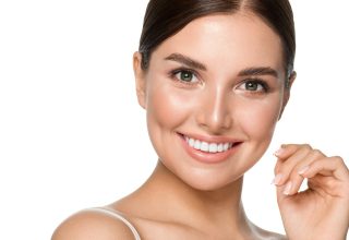Beautiful woman with healthy teeth smile clean fresh skin isolated on white portrait